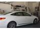 View from the garage with car parked and access to utility items at 6836 Sw 112Th St, Ocala, FL 34476
