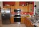 Well-equipped kitchen with stainless steel appliances, oak cabinets, and plenty of counter space at 6836 Sw 112Th St, Ocala, FL 34476
