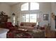 Inviting living room with large windows, neutral-toned sofa, and a decorative area rug at 6836 Sw 112Th St, Ocala, FL 34476