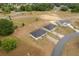 An aerial view of single Gathering homes on large lots, ready for personalization, with a paved street showing access to the properties at 69 Juniper Trail Loop, Ocala, FL 34480