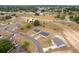Aerial view of a residential area with charming homes, surrounded by lush greenery and beautiful landscapes at 69 Juniper Trail Loop, Ocala, FL 34480