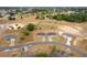 A scenic aerial view showcasing single-Gathering homes within a developing residential neighborhood at 69 Juniper Trail Loop, Ocala, FL 34480
