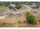 Panoramic shot capturing numerous homes in a planned community, each with a well-manicured lawn, highlighting the neighborhood layout at 69 Juniper Trail Loop, Ocala, FL 34480
