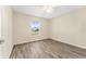 This room has wood-style floors, and a window with a view of the outside at 69 Juniper Trail Loop, Ocala, FL 34480