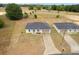 Charming single-story home with a two-car garage and long paved driveway at 69 Juniper Trail Loop, Ocala, FL 34480