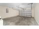 Spacious garage interior showing the garage door, ceiling and walls at 69 Juniper Trail Loop, Ocala, FL 34480