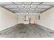 Spacious garage interior showing the hot water heater, and ceiling at 69 Juniper Trail Loop, Ocala, FL 34480