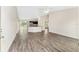 Open-concept living space with hard surface floors and bright lighting at 69 Juniper Trail Loop, Ocala, FL 34480