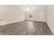 Bright living room features neutral walls and attractive wood-look flooring at 69 Juniper Trail Loop, Ocala, FL 34480