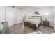 Spacious bedroom with a large bed, bedside tables, and a serene atmosphere at 7706 Sw 89Th Ct, Ocala, FL 34481