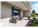 Inviting front porch with cozy seating and landscaping, offering a relaxing space with great curb appeal at 7706 Sw 89Th Ct, Ocala, FL 34481