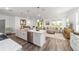 Bright kitchen overlooking the living room, features stainless steel appliances and a central island at 7706 Sw 89Th Ct, Ocala, FL 34481