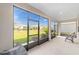 Screened lanai with seating overlooking the green backyard at 7706 Sw 89Th Ct, Ocala, FL 34481