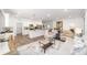 Open-concept living area with a modern kitchen, stylish furnishings, and lots of natural light at 7706 Sw 89Th Ct, Ocala, FL 34481