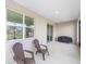 Inviting covered patio with comfortable seating, perfect for outdoor relaxation and entertaining at 7706 Sw 89Th Ct, Ocala, FL 34481