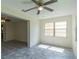 Bright dining area with neutral tones, ceiling fan, and smooth tile flooring at 8654 Sw 96Th St # D, Ocala, FL 34481