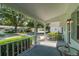 View of the front porch with decorative trim, offering a welcoming outdoor space at 8654 Sw 96Th St # D, Ocala, FL 34481