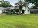 Charming single-story home featuring a well-maintained lawn and an inviting front porch at 8654 Sw 96Th St # D, Ocala, FL 34481