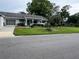 Charming single-story home featuring a well-maintained lawn and an inviting front porch at 8654 Sw 96Th St # D, Ocala, FL 34481