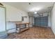 Spacious garage with ample room for parking and storage, featuring a workbench and garage door at 8654 Sw 96Th St # D, Ocala, FL 34481