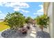 Landscaped backyard featuring a stone pathway and water fountain at 8998 Sw 75Th Loop, Ocala, FL 34481