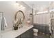 Bathroom featuring a single vanity, stylish decor, and shower/tub combo at 8998 Sw 75Th Loop, Ocala, FL 34481