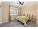 Cozy bedroom with a ceiling fan and a beautiful rug at 8998 Sw 75Th Loop, Ocala, FL 34481