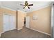 Bedroom with ceiling fan and closet at 8998 Sw 75Th Loop, Ocala, FL 34481