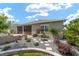 Beautiful home exterior with lush landscaping, fountain, and patio area at 8998 Sw 75Th Loop, Ocala, FL 34481