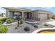 Attractive single-story home showcasing a landscaped front yard with decorative stone and a welcoming entrance at 8998 Sw 75Th Loop, Ocala, FL 34481