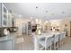 Modern kitchen showcasing granite countertops, stainless steel appliances, and a spacious island at 8998 Sw 75Th Loop, Ocala, FL 34481