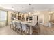 Beautiful kitchen island with pendant lighting and bar stool seating, perfect for entertaining at 8998 Sw 75Th Loop, Ocala, FL 34481