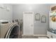 Laundry room features machines and decor at 8998 Sw 75Th Loop, Ocala, FL 34481