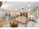 Open-concept living space featuring a view of the kitchen island and comfortable seating at 8998 Sw 75Th Loop, Ocala, FL 34481
