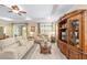 Elegant living area showcasing a comfortable sofa set and a detailed entertainment center at 8998 Sw 75Th Loop, Ocala, FL 34481