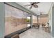 Inviting screened patio with ceiling fans and wicker furniture at 8998 Sw 75Th Loop, Ocala, FL 34481