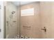 Modern walk-in shower with glass door, rainfall shower head, and mosaic tile floor at 8998 Sw 75Th Loop, Ocala, FL 34481
