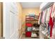 Well-organized walk-in closet providing ample storage with shelving and hanging space at 8998 Sw 75Th Loop, Ocala, FL 34481