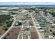 High-angle view of a community, showcasing the layout, homes, and green spaces at 9 Walnut Run, Ocala, FL 34480