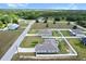 Aerial image of homes, roads, and landscaping in a residential neighborhood at 9 Walnut Run, Ocala, FL 34480