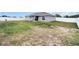 Exterior view of backyard, home, and fence at 9 Walnut Run, Ocala, FL 34480