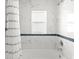Light-filled bathroom highlighting a tub with marbled tiling at 9 Walnut Run, Ocala, FL 34480