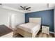 Inviting bedroom with a queen-sized bed, tray ceiling, and neutral color palette, creating a relaxing atmosphere at 9 Walnut Run, Ocala, FL 34480