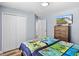 Nicely decorated bedroom featuring a matching dresser and built in closet at 9 Walnut Run, Ocala, FL 34480