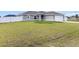 Serene landscape surrounding a charming home with a well-kept lawn, and inviting curb appeal at 9 Walnut Run, Ocala, FL 34480