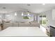 Open floor plan showcasing the kitchen island, seamlessly connecting to the dining and living area at 9 Walnut Run, Ocala, FL 34480