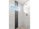 Beautiful tile shower accented with dark vertical tile at 9 Walnut Run, Ocala, FL 34480