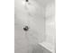 Luxurious tiled shower with a built-in seat at 9 Walnut Run, Ocala, FL 34480