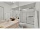 Clean bathroom with shower, tub, and vanity, offering a functional and well-maintained space at 9565 Sw 194Th Cir, Dunnellon, FL 34432