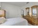 Comfortable bedroom features vintage wooden dresser, closet and light, providing a relaxing and inviting space at 9565 Sw 194Th Cir, Dunnellon, FL 34432